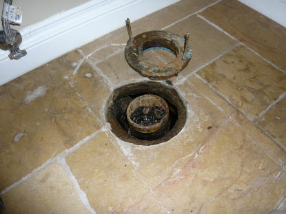 Toilet Flange: Connection leaks creating water damaged plywood under bathroom tile